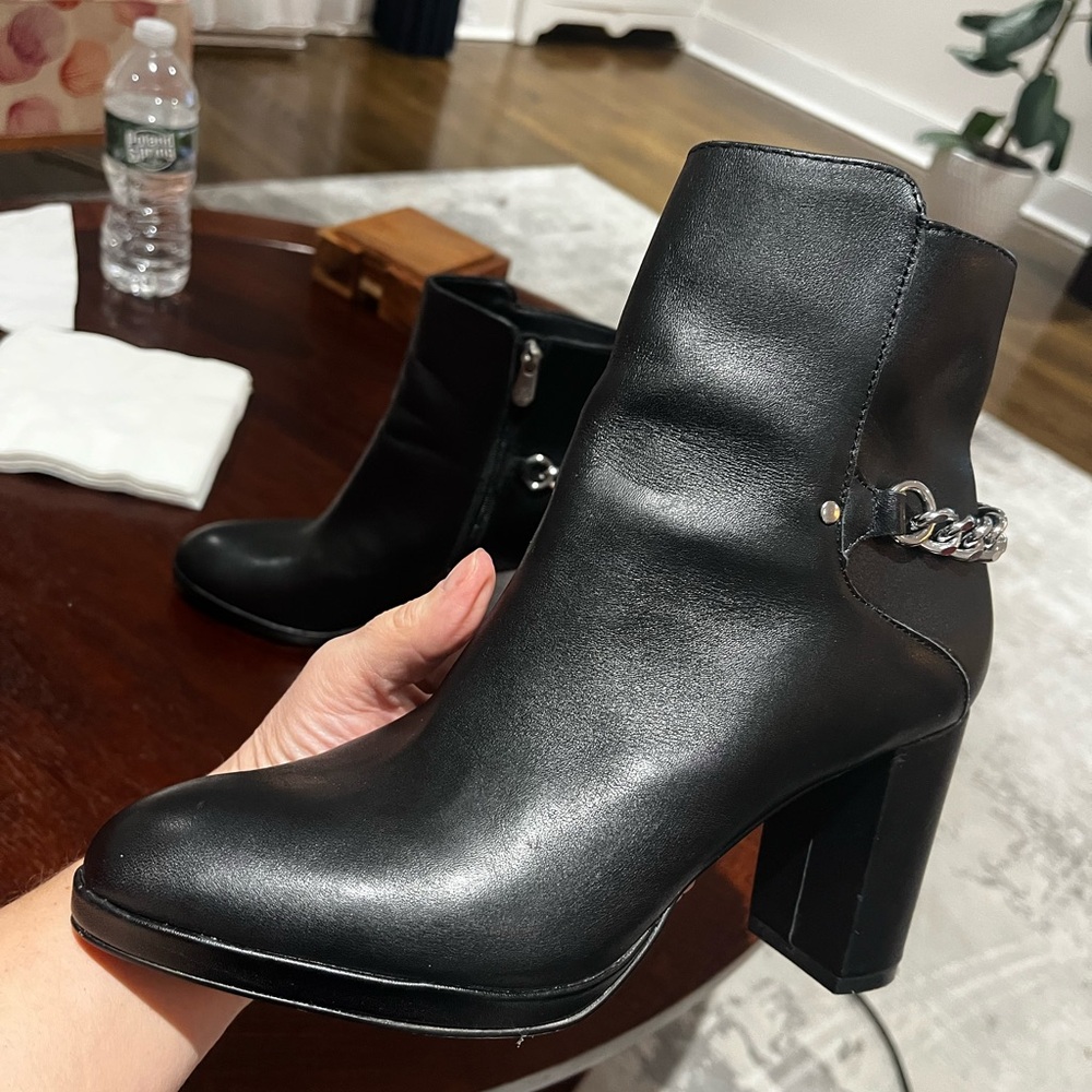 Chic Black Leather Ankle Boots with Chain Detail